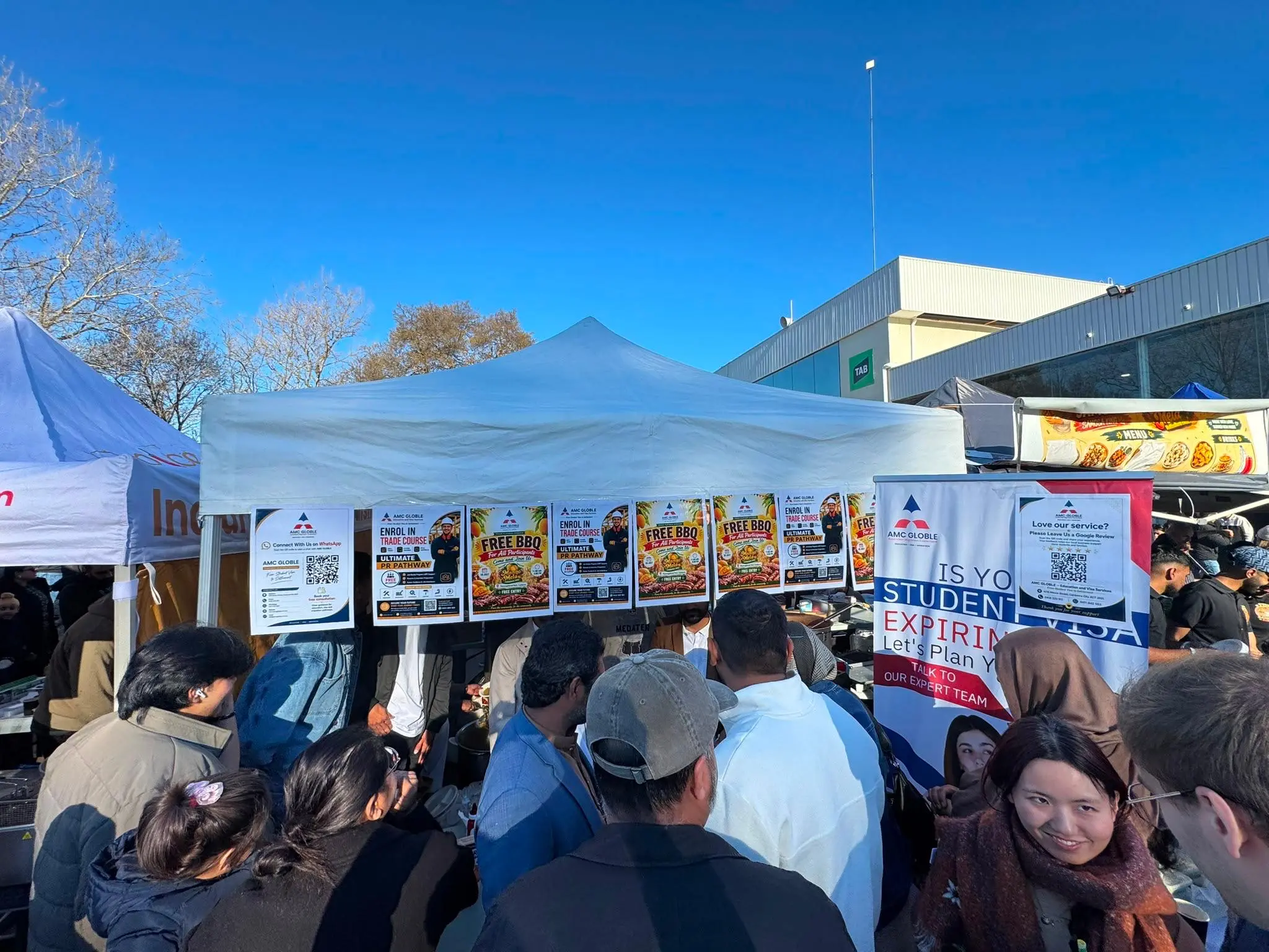 AMC GLOBLE BBQ stall serving FREE BBQ at Mango Mela Canberra 2026